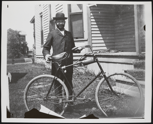 Man with bicycle.